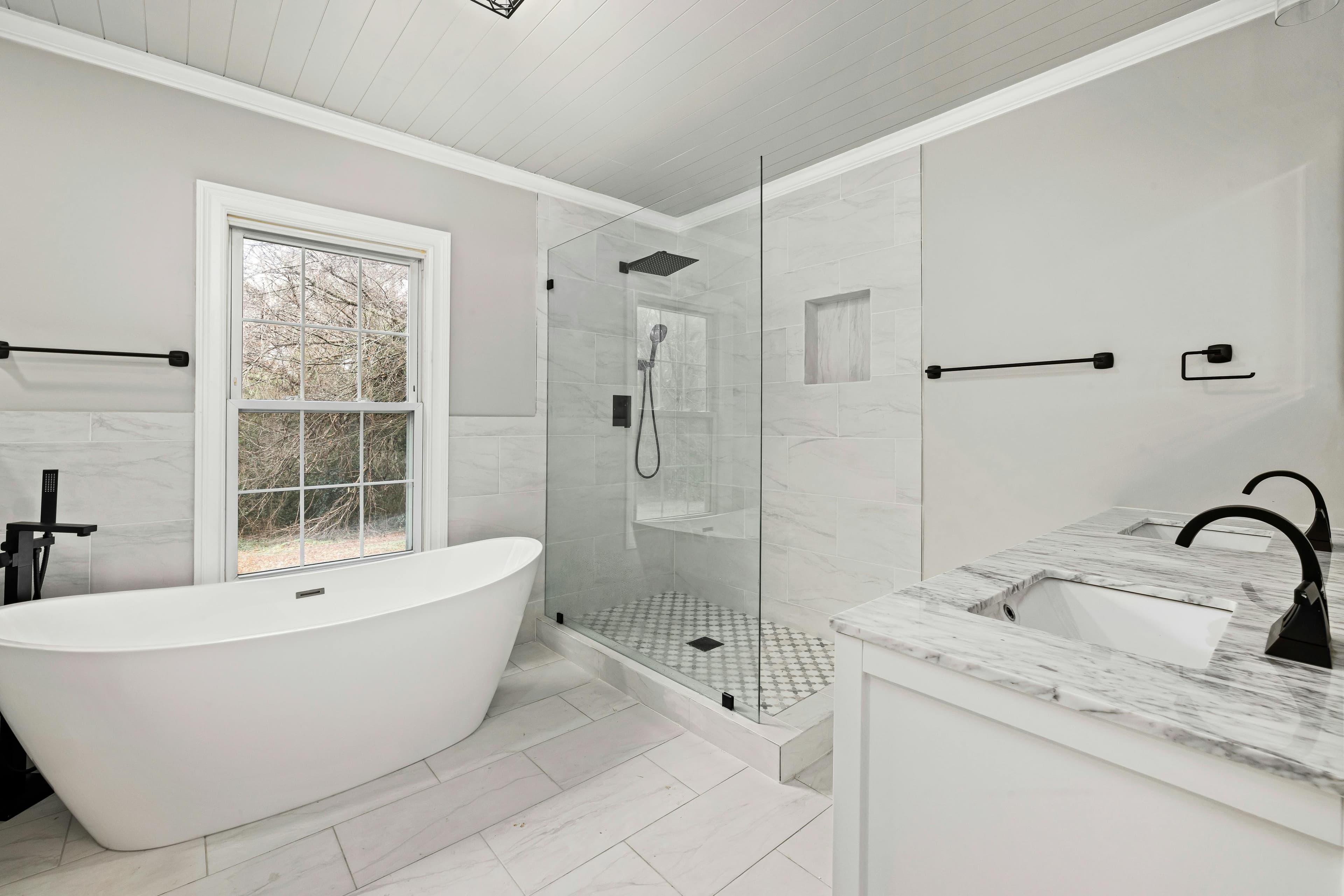 Spa bathroom with freestanding tub, walk-in shower, and shiplap ceiling in Lancaster, Ohio