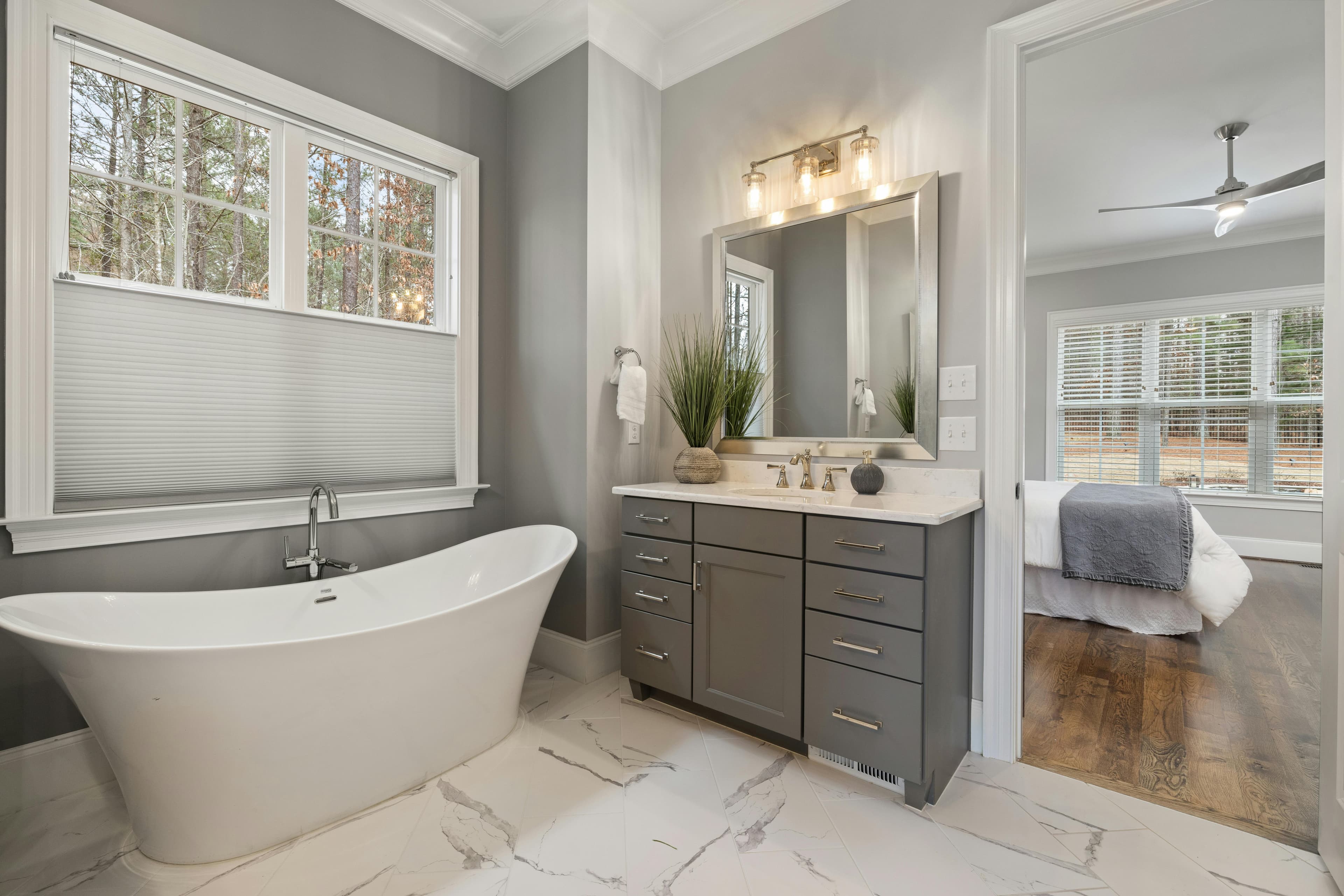 Modern gray bathroom with freestanding tub and marble floors in Lancaster, Ohio